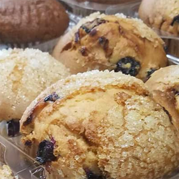 Crumbly blueberry muffins with sugar coating on top